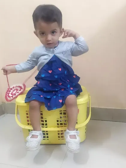 Another adorable shot of my little one and her handmade bag. These moments are what make my work so meaningful.