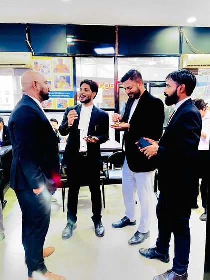 A candid moment during the birthday celebrations at the High Court.