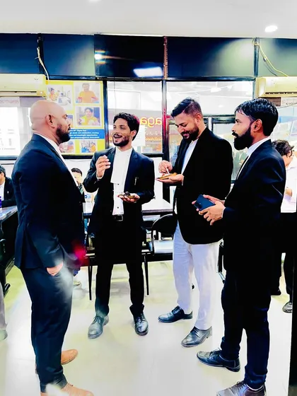 Sharing a light moment with colleagues during the celebration.