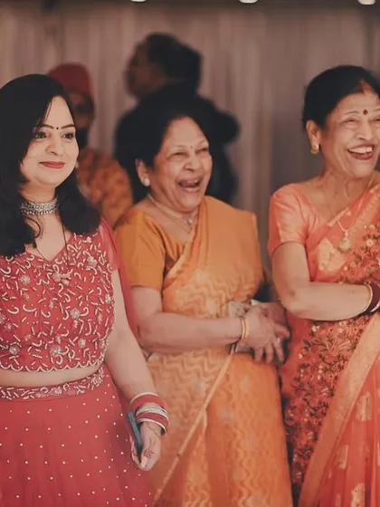 Weddings are about family. We love capturing candid moments of joy, like the genuine laughter and happiness shared between guests during the celebration.
