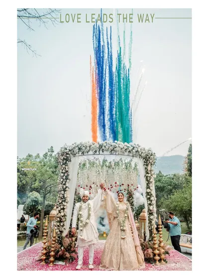 This is what a destination wedding is all about. We love capturing the peak of the celebration, like this varmala moment in the mountains, complete with vibrant smoke colors that make the memory feel as epic as it was in person.