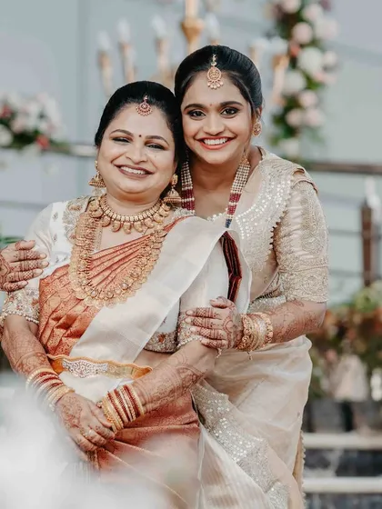 There is no moment more precious than a mother seeing her daughter as a bride. Our beautiful client shares a heartfelt embrace with her mother, both radiating joy. It is an honor to create heirloom pieces that become part of such unforgettable family memories.