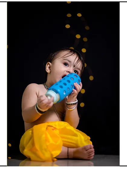 This image shows the beautiful bokeh effect created by the background lights in my studio, adding a magical touch to this child's portrait.
