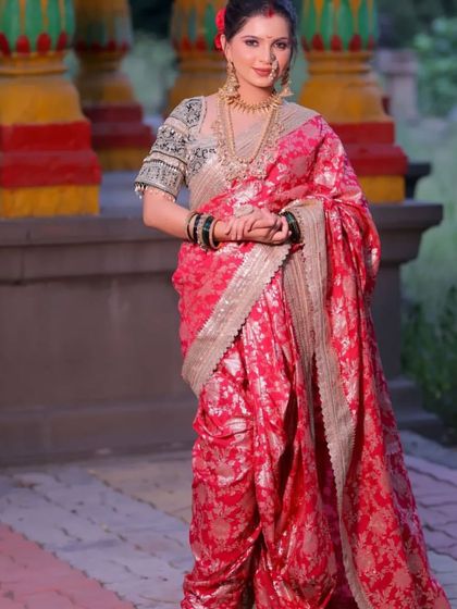 A full shot of the model in the pink Navvari saree, looking poised and elegant.