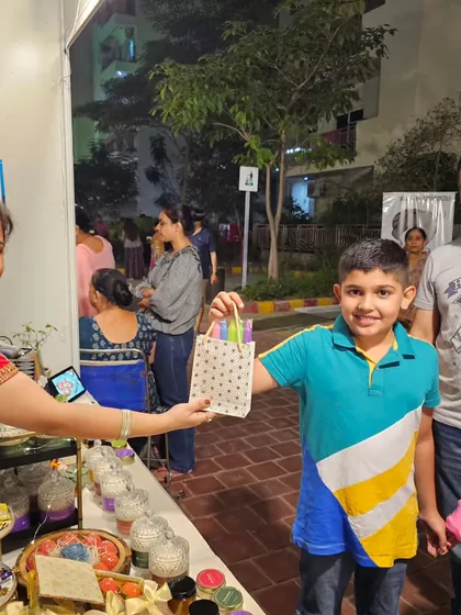A young customer and his family picking out some treats. It's wonderful to see people of all ages enjoying the magical aromas of my candles.