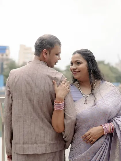 A quiet moment of connection between Susheta and Abhishek by the water. Her hand on his shoulder and the gentle look they share speak volumes about their bond.