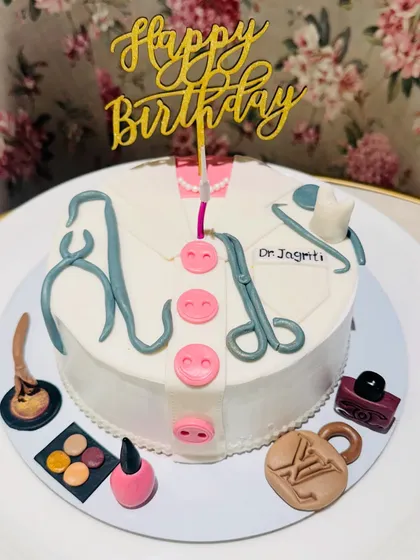 I design cakes that tell a personal story. This custom birthday cake for a doctor combines her profession with her passions, featuring fondant medical tools alongside makeup and fashion accessories.