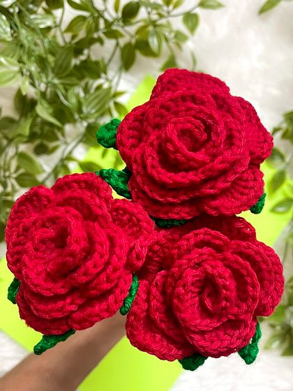 A detailed look at the handmade red roses for the bouquet. I love how the petals spiral to create a realistic look.