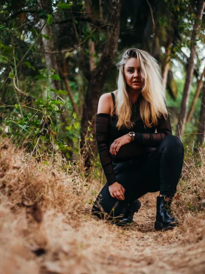 A kneeling pose from my outdoor shoot in Goa, connecting with the natural surroundings.
