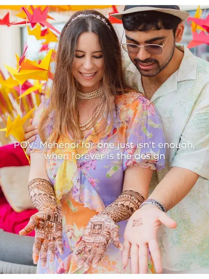 "Mehendi for one just isn't enough, when forever is the design." The couple showing off their beautiful henna, a symbol of their shared journey.