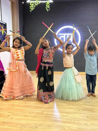 Look at the joy on these faces. This is from our kids' Garba and Dandiya celebration. I love bringing festive energy into the studio, and the kids get to learn traditional dance forms in colorful costumes.
