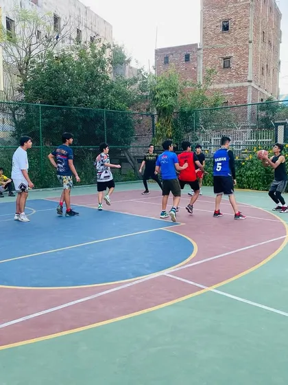 A player prepares to take a shot while teammates look on.