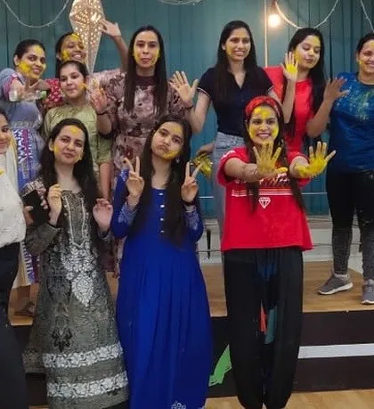 More happy faces from the Holi festivities, showing off their colorful hands. We make sure every festival is an excuse for a dance party.