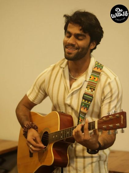 Another talented musician enjoying his time on stage, sharing his passion with an encouraging audience.