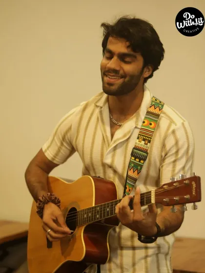 Another talented musician enjoying his time on stage, sharing his passion with an encouraging audience.