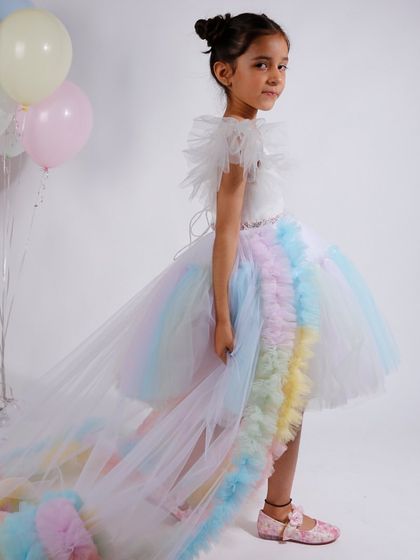 This rainbow gown comes with a long, detachable train, adding a touch of drama and versatility.