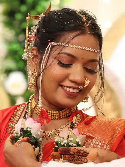 A happy, eyes-closed smile from the bride. This candid moment shows the joy of the wedding day, with makeup that stays put.