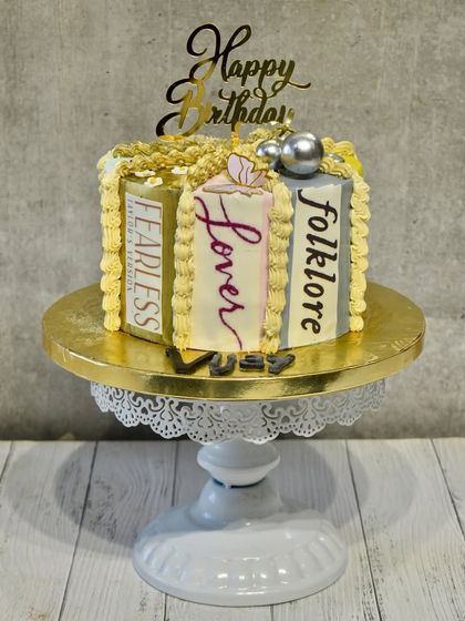 Are you ready for it? A cake for the ultimate Swiftie, designed to look like a stack of Taylor Swift's iconic albums: Fearless, Lover, and Folklore.