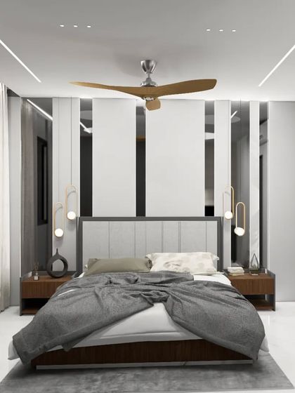 This bedroom design uses vertical panels and mirrors to create a sense of height and drama. The symmetrical layout, with hanging pendant lights on either side of the bed, results in a balanced and contemporary look.