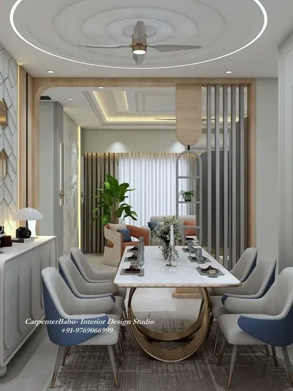 An angled view showing the relationship between the living and dining areas, connected by a wooden-paneled archway.