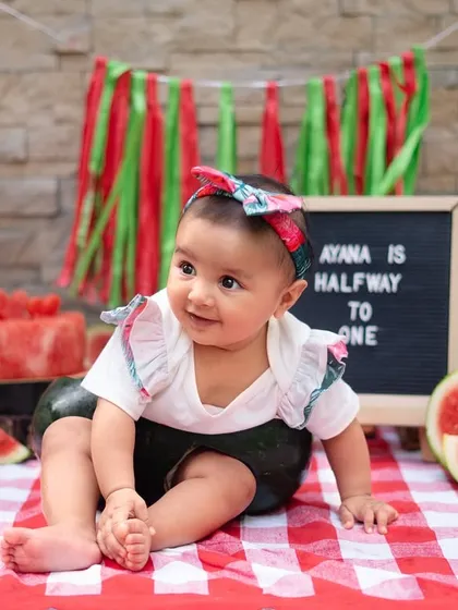 A sweet pose from our little watermelon model. I offer different outfits and props during a session to provide a variety of beautiful shots.
