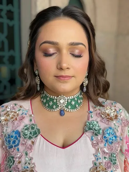 A close-up of the eye makeup for the carnival look. The soft metallic rose eyeshadow is blended beautifully to create a shimmery, eye-catching effect.