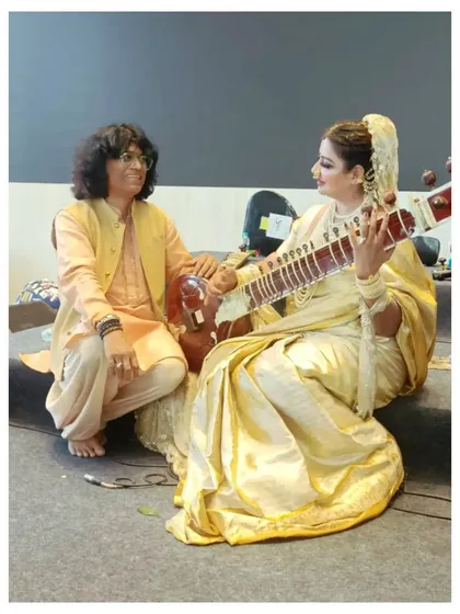 A candid moment backstage in Hyderabad, sharing a musical thought with one of the performers. The symphony is a collaborative effort.