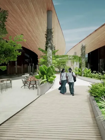 For the Cochin International Airport, we designed the central shopping aisle as a green corridor. The walkway is buffered by lush, tropical planting and tall pillars covered in creepers, transforming a functional space into a garden-like experience.