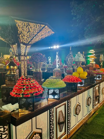 A colorful array of fruits, including stacked strawberries and kiwis, creating a visually spectacular display.