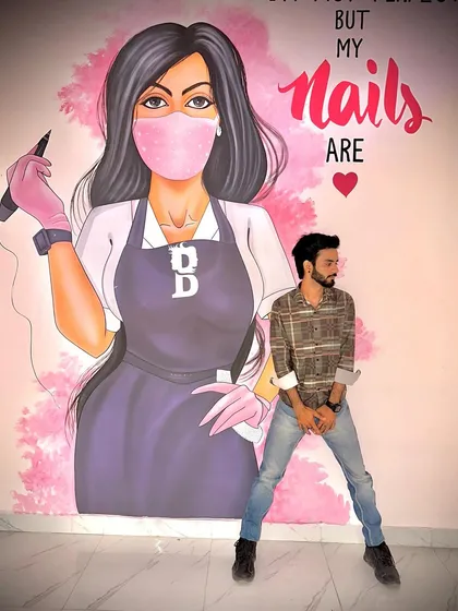Here I am in my element, at my studio. I believe that the space you're in should be as inspiring as the art itself. This mural is a daily reminder that while we may not be perfect, our nails, brows, and lips can be.