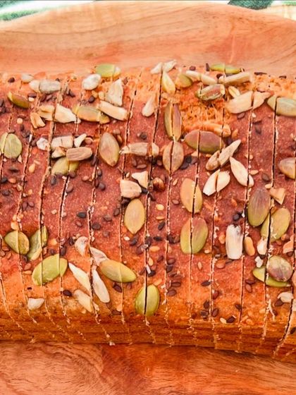 A beautiful top-down view of a freshly sliced loaf. This bread is perfect for anyone looking for a clean, plant-based protein source that is both delicious and versatile.