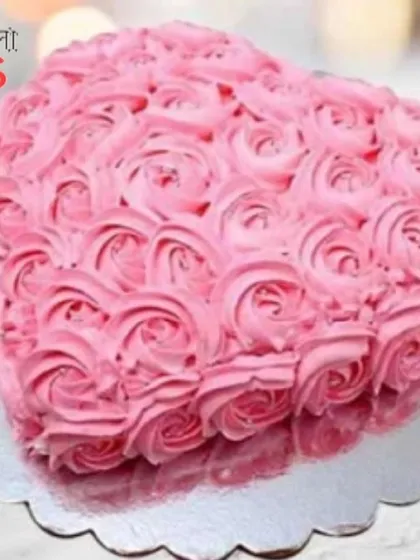 This heart-shaped cake is fully covered in beautiful pink buttercream rosettes. The detailed piping work makes it a visually stunning choice for anniversaries, birthdays, or Valentine's Day.