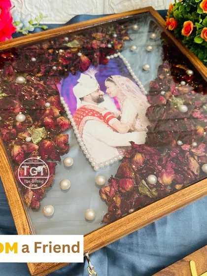 An angled view of the frame, showing the depth of the wood and the floating effect of the pearls in the resin.