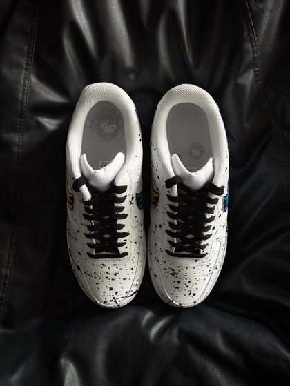 A top-down view of the dual-color drip custom sneakers.