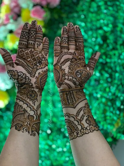 An Indo-Arabic design with a mix of bold and fine lines. The patterns are intricate and create a rich, textured look, set against a beautiful floral background.