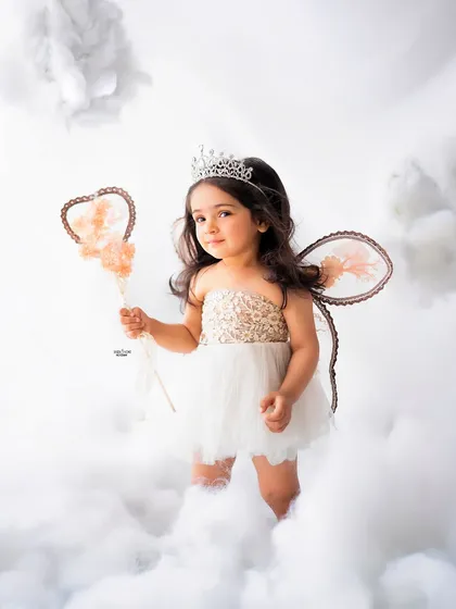 A confident pose from this little angel, ready to take flight.