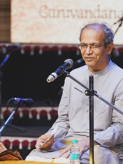 A respected elder speaking at my Appa's 'Suvarna Venu' celebration. The room was filled with positive vibrations and love from friends, family, and well-wishers.