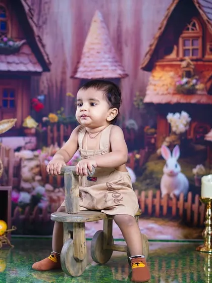 A thoughtful pose from the little girl in our enchanting bunny-themed setup.