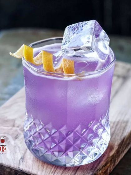 We believe a great cocktail is a must for any celebration. This beautiful purple gin-based drink is an example of the elegant and modern cocktails we serve.