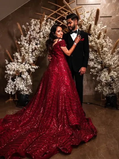 A wide shot showing off the magnificent train of the bride's red sequined gown. This is a true "wow" shot.