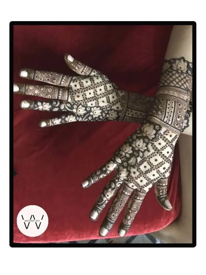 A beautiful back-hand design for an engagement, featuring a mix of jaal patterns and delicate floral work.