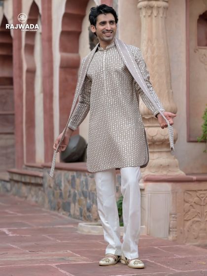 This beige printed kurta set from the Riwayat collection offers a relaxed yet elegant vibe. Paired with a matching stole, it's a perfect choice for a daytime event or a pre-wedding ceremony.