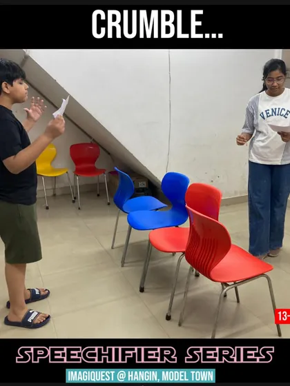 A student practices delivering a speech, learning to manage his nerves and project his voice. Our public speaking workshops for teens focus on practical skills for confident communication.