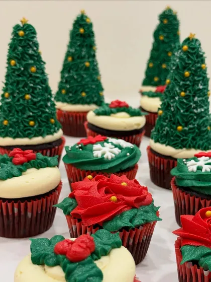 Merry Christmas! My moist Belgian chocolate cupcakes with signature vanilla buttercream frosting, decorated as festive Christmas trees and wreaths, were a holiday favorite.