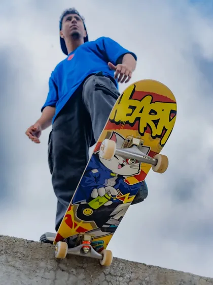A low-angle shot from the Hearty photoshoot, making the skateboard deck the hero. The design is meant to inspire skaters to push their limits.