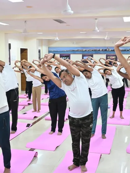 Officers practicing a side-bending asana to stretch the torso and improve spinal flexibility. These are ideal exercises for those who spend long hours standing or sitting.