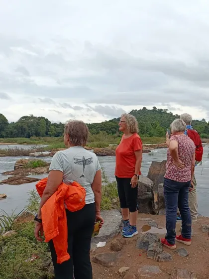 Pausing to admire the view. On our Mysore to Goa tour, we often stop at scenic spots like this riverbank to just take it all in. It is about the journey, not just the destination.