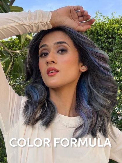 This shot captures the full beauty of the ash, lilac, and blue blend. The model's pose shows off the color in natural light, highlighting the cool, smokey finish.