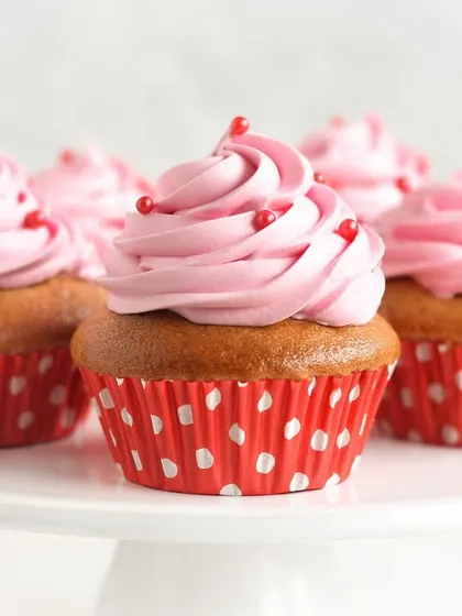 A delightful array of our Strawberry Cupcakes, with fluffy vanilla sponge and swirls of pink strawberry buttercream. They are a simple, joyful treat that everyone loves.