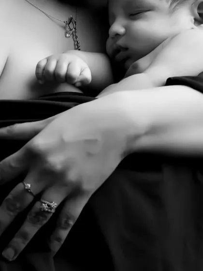 Focusing on the tiny details, this shot shows a mother's protective hand over her sleeping newborn. We believe these small details tell a big story about love and family.